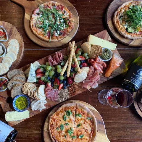 a bunch of food sitting on top of a wooden table