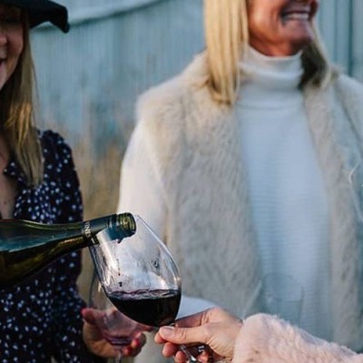 a woman holding a wine glass