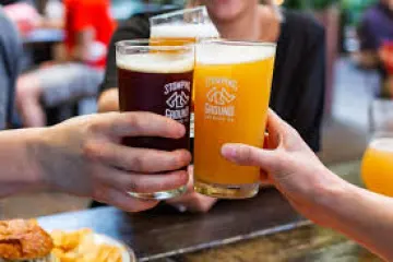 a person sitting at a table eating food