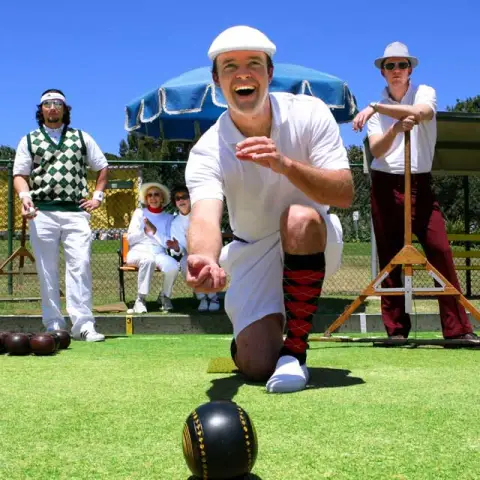 a group of people playing football on a field